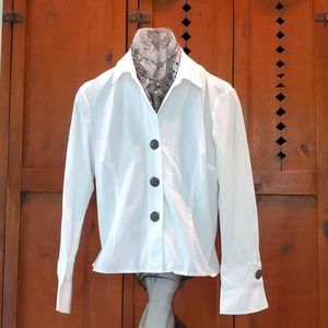 fitted white cotton shirt embellished  with large fillagree silver buttons.
